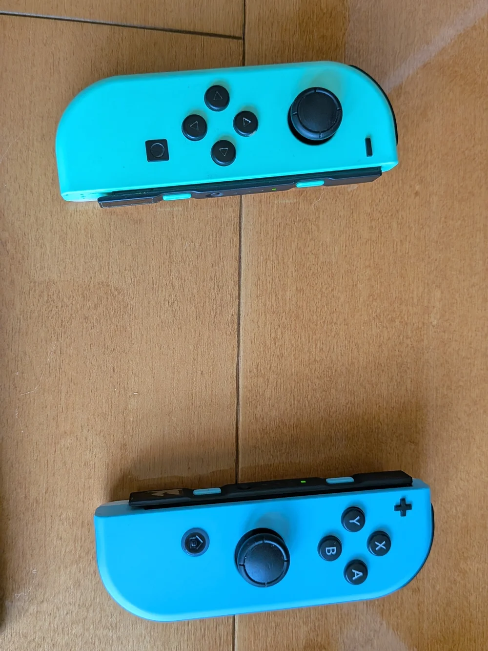 Nintendo Switch with Bright Turquoise and Cyan Joy-Con. Two Games Included